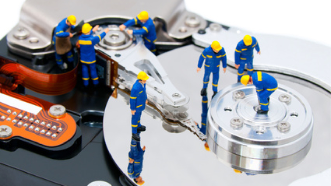 Group of technicians repair hard drive